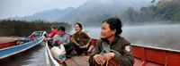 'Group of women on the Nam Ou River. 

The Nam Ou spans 450 kilometers, flowing south from mountains near the Lao-China border in Northern Laos to meet the waters of the mainstream Mekong River. Along the way, the river traverses through the provinces of Phongsaly, Oudomxay and Luang Prabang, past mountains, forested valleys and stunning limestone karsts. Yet, fundamental changes to the riparian ecosystems and surrounding communities are underway as the development of a seven-dam cascade by China’s Sinohydro Corporation moves forward. Read more here: http://www.internationalrivers.org/campaigns/nam-ou-river'
