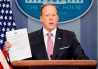 White House press secretary Sean Spicer holds up a Trump Administration document to repeal and replace Obamacare as he talks to the media during the daily press briefing at the White House in Washington, Friday, March 10, 2017.